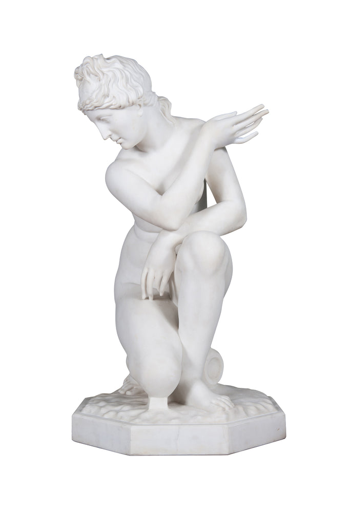 A LARGE ITALIAN CARRARA MARBLE SCULPTURE OF CROUCHING VENUS