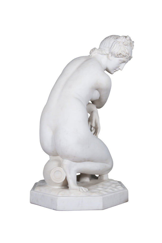 A LARGE ITALIAN CARRARA MARBLE SCULPTURE OF CROUCHING VENUS