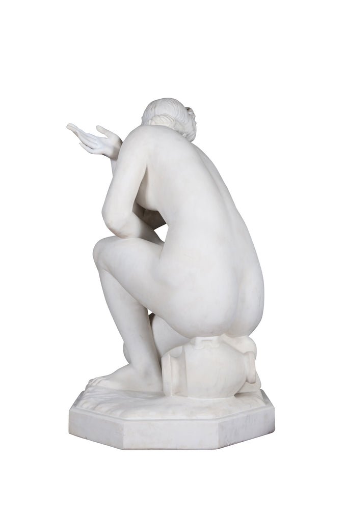 A LARGE ITALIAN CARRARA MARBLE SCULPTURE OF CROUCHING VENUS